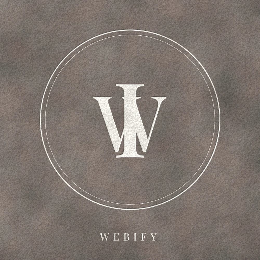 The WebIFY monogram logo, embossed in white on textured stone